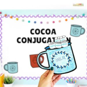 Image shows a winter themed bulletin board with the words "Cocoa Conjugation". In the foreground there is a colored mug with the word "Hablar" and marshmallows with the conjugated forms of the verb hablar.