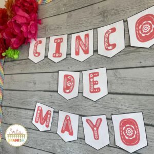 Pictured: Printable Cinco de Mayo free banner printed and hung on a classroom bulletin board